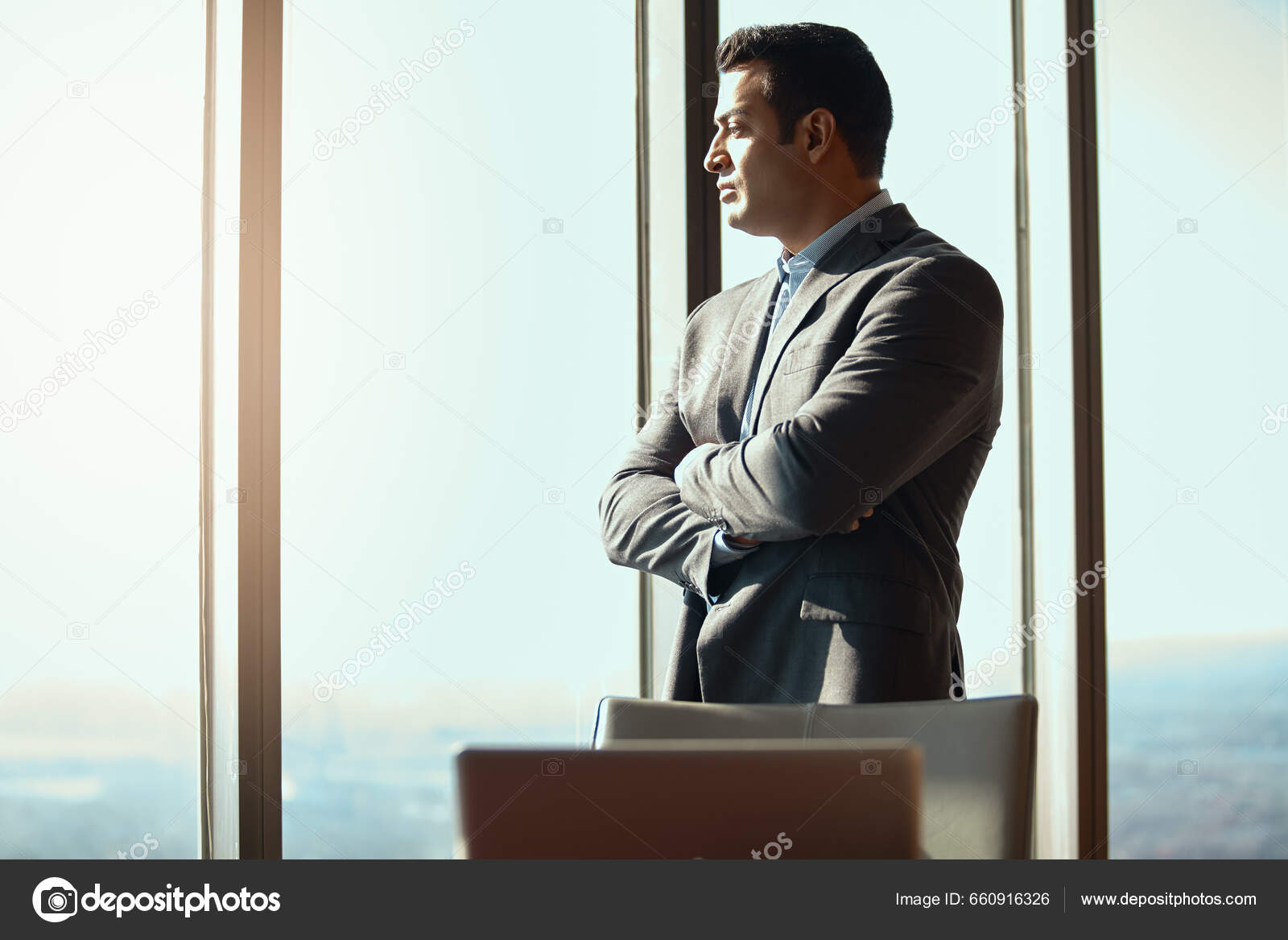 https://st5.depositphotos.com/62628780/66091/i/1600/depositphotos_660916326-stock-photo-business-man-office-window-thinking.jpg