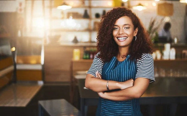 Coffee shop, crossed arms and portrait of woman in cafe for service, working and professional in bistro. Small business owner, restaurant startup and female waiter smile in cafeteria ready to serve.