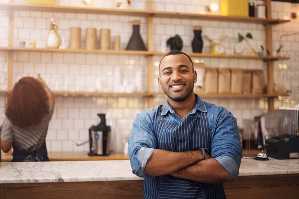 stock image Coffee shop, crossed arms and portrait of black man in cafe for service, working and restaurant startup. Small business owner, professional barista and male waiter smile in cafeteria ready to serve.