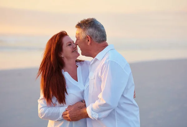 stock image I love you more and more each day. mature people enjoying the sunset on the beach