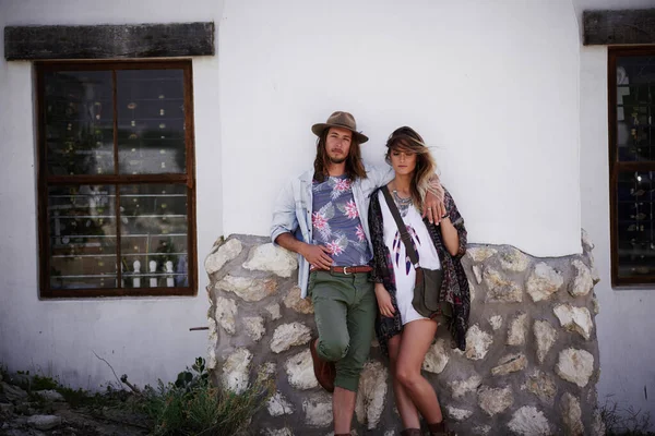 stock image Wherever we are is home. a trendy young couple standing together against the wall of a building outside