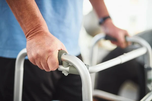 stock image Each step brings you closer to recovery. Closeup shot of a senior man using a walker