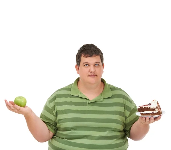 プラスサイズ 食事の決定とバランスについて考えるアップルとケーキの選択と男の肖像画 体重減少と栄養モックアップと健康とデザートと男性モデル スタジオと白の背景 — ストック写真