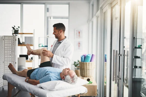 Assessing His Range Movement Young Male Physiotherapist Assisting Senior Patient — Stock Photo, Image