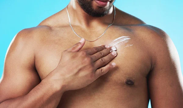 Skincare Applying Man Cream His Chest Isolated Blue Background Studio — Stock Photo, Image