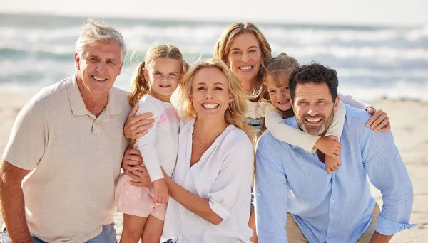 Family at beach, grandparents and parents with kids in portrait, travel and freedom with love and vacation. Face of happy people, generations and tourism in New Zealand while bonding together outdoor.