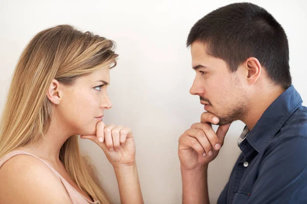 Weighing Options Serious Young Couple Looking Intently One Another Stock Image
