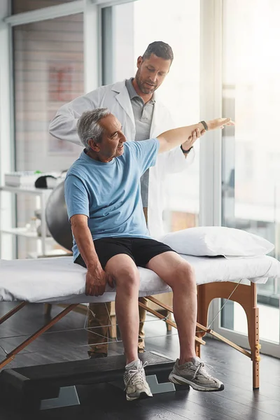 Recovery Quick His Guided Hands Young Male Physiotherapist Assisting Senior — Stock Photo, Image