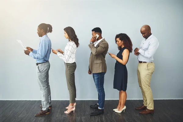 Opportunity Called Answered Studio Shot Group Businesspeople Waiting Queue Gray — Stock Photo, Image