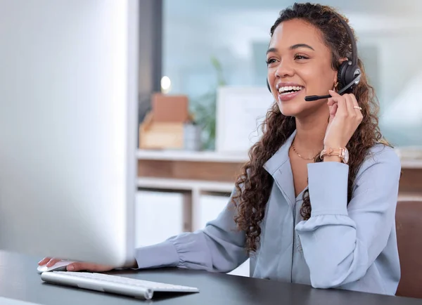 stock image Customer service, computer and a woman consulting in her office for telemarketing, sales or assistance. Call center, support and crm with a happy young female employee working online using a headset.