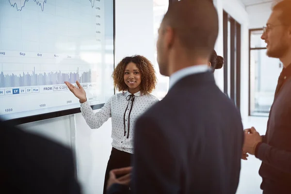 stock image She excels in the boardroom. a young businesswoman giving a presentation in the boardroom