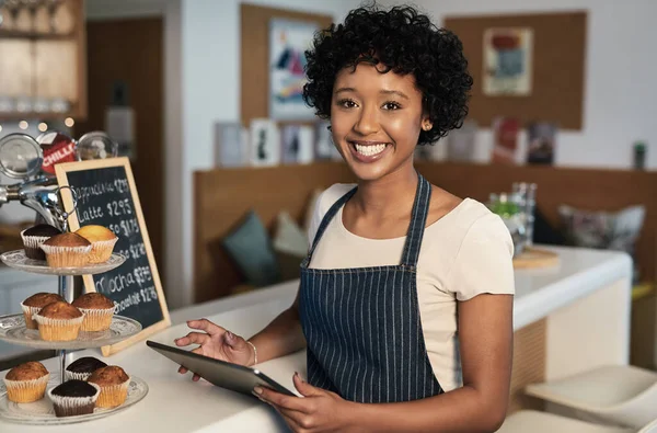Happy woman, tablet and portrait of barista at cafe for order, inventory or checking stock in management. Female person, waitress or employee on technology small business at coffee shop restaurant.