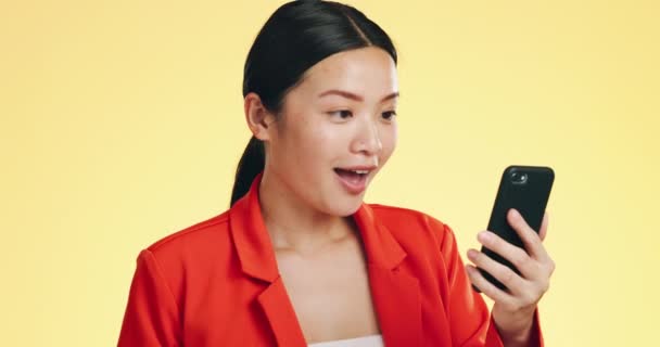 Winner Success Celebration Asian Woman Phone Studio Isolated Yellow Background — Stock Video