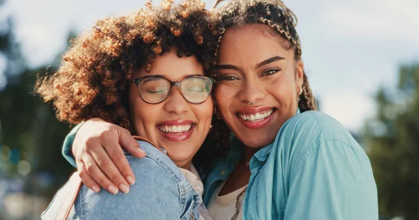 Friends, sisters and portrait of black women hugging outside with smile, happiness and solidarity in love and pride. Lesbian couple, woman and friend in happy embrace for support and trust together