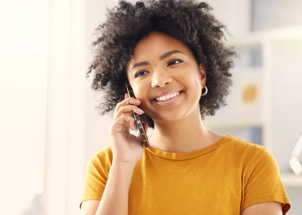 stock image Happy woman, phone call and talking in home, conversation or chat with contact. Mobile, communication and smile of African person in discussion, listening to news or speaking for networking in house