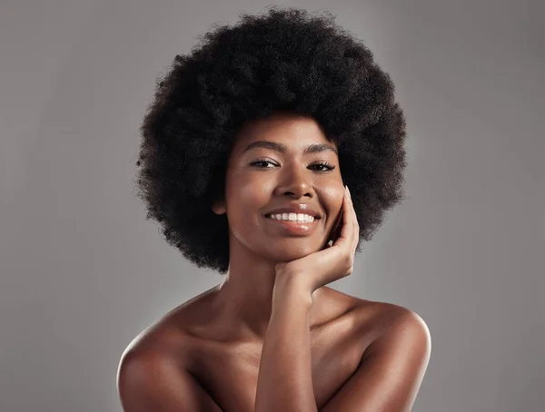 Skincare, portrait of happy black woman and in a studio background for beauty cosmetics. Confidence or elegance, cosmetology or glowing and face of African female pose health wellness in backdrop.