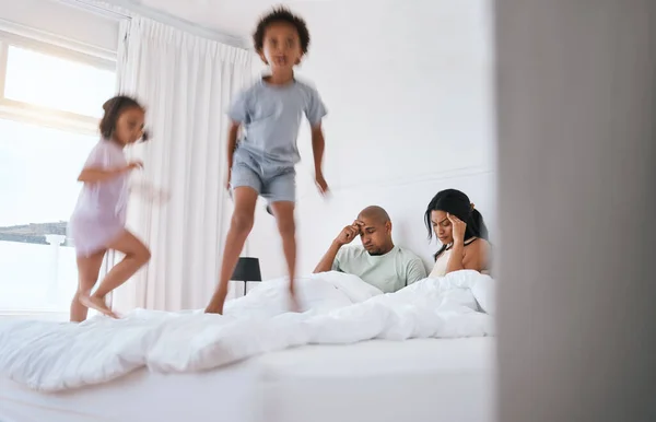 Young Kids Jump Parents Bed Playing Game Excited Family House — Stock Photo, Image