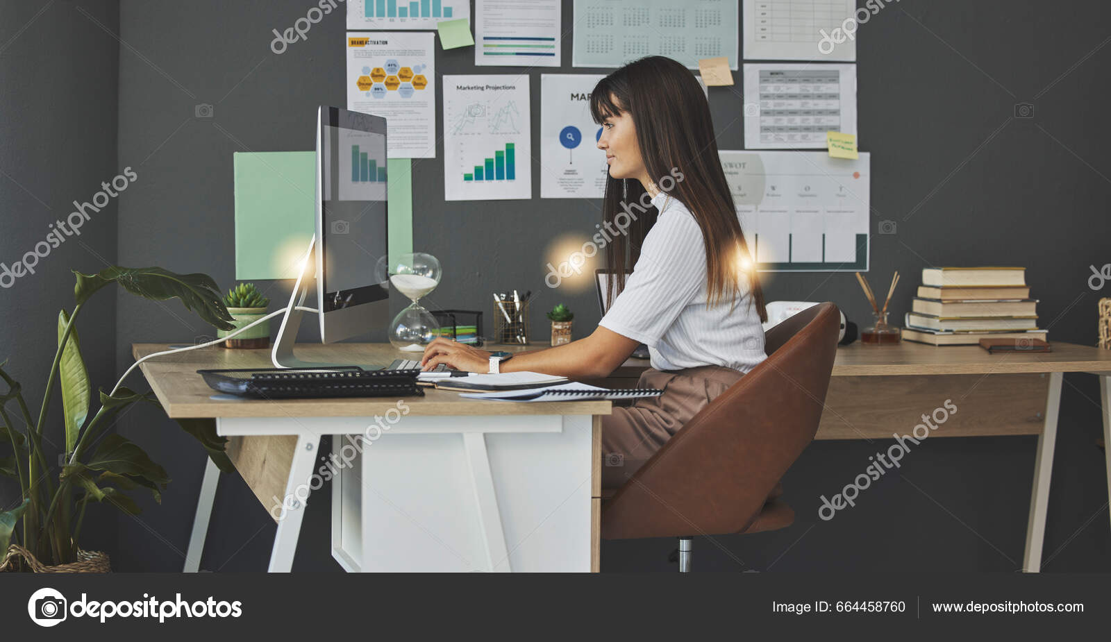 A person sitting at a desk, looking thoughtful while reviewing a calendar