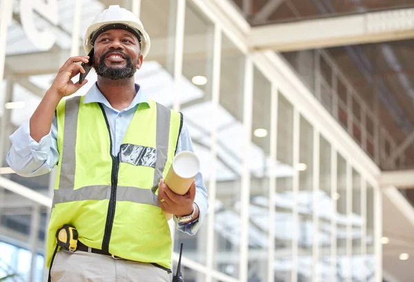Architecture, black man or engineer on a phone call conversation for building construction. Blueprint, industrial or African designer in a discussion networking or speaking of engineering project.