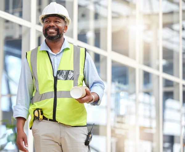 Black man, blueprint or construction manager walking in building site for project management. Engineering, contractor or designer thinking of floor plan for architecture, development and innovation.