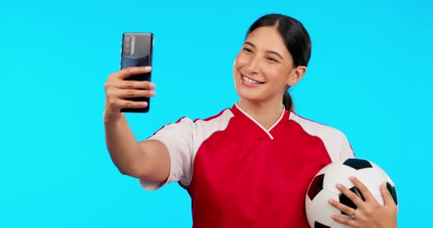 Young woman, sport selfie and studio with football, peace sign and happy for fitness, social media app or post. Girl, professional soccer player and smile with icon, ball or excited for internet blog.