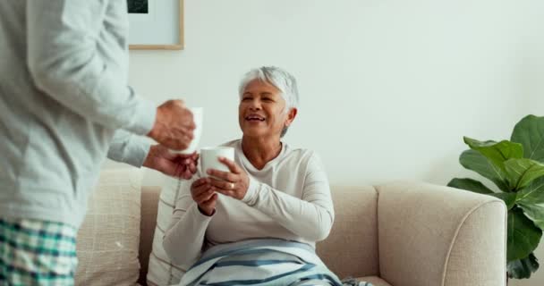 Senior Couple Giving Drinking Coffee Sofa Home Living Room Morning — Stock Video