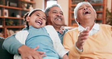 Child, grandparents and laughing on home sofa to relax, bond and quality time together. A happy senior man, woman and a girl child in family living room for funny memory with happiness, love and care.