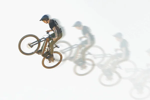 Bicycle, trick or man riding in the air with speed, motion or overlay of cycling, jump or person training to do a crazy stunt. Cyclist, adrenaline and double exposure of parkour, sports or cycling.