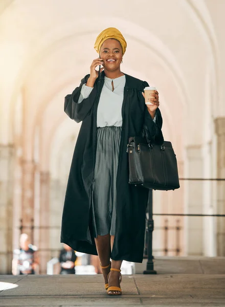 Woman with coffee, phone call and lawyer outside court with smile, consulting on legal advice and walking to work. Cellphone, law firm attorney or happy judge networking, talking and chat in city