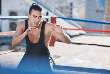 Man, wrestler and fight with in ring training on rooftop with for sport competition in outdoor. Athlete, fitness and wrestling with martial arts for workout in city with serious face for contest clipart