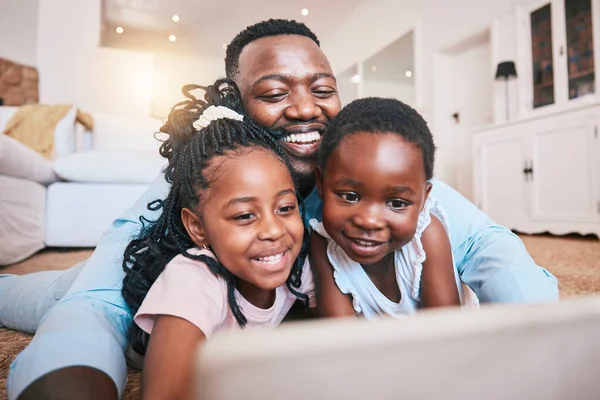Online, happy and tablet with black family in living room for streaming, games and elearning app. Digital, technology and internet with man and children at home for movies, education and network.