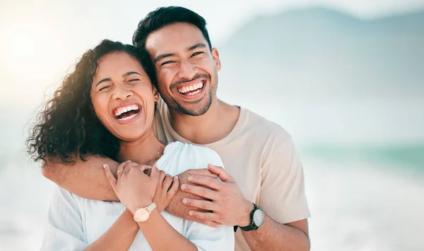 Love, happy and funny with couple on beach for travel, summer and vacation. Peace, smile and relax with portrait of man and woman hugging on date for seaside holiday, care and mockup space.