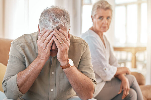 Senior couple, divorce and conflict in fight, argument or disagreement on living room sofa at home. Elderly woman and frustrated man in depression, cheating affair or toxic relationship in the house.