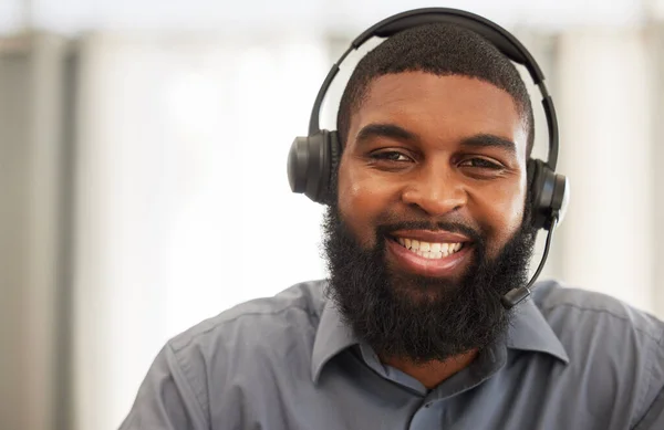 Man, portrait and call center agent or consultant for communication, technical support and consulting online. Happy face of African person for virtual consultation, IT helping or contact us at agency.