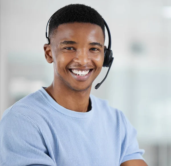 Portrait, customer service and arms crossed with a black man consultant standing in his office for support. Call center, contact us and trust with a happy male telemarketing employee in the office.