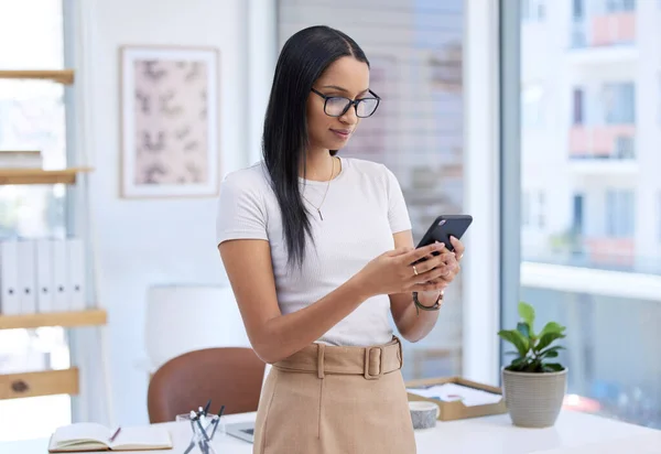 stock image Business woman with smartphone, chat and typing with social media, communication and connectivity in workplace. Female professional on break, mobile app with text message and using phone at office.