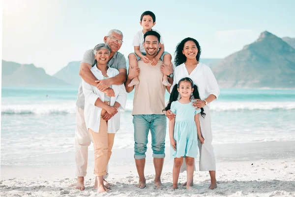 Grandparents, parents or portrait of happy kids at beach as a big family for holiday vacation travel. Grandfather, grandmother or mom with dad or children siblings in nature at sea bonding together.