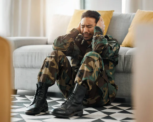 Soldier, sad and ptsd with man in living room for depression, stress and psychology. Army, military and war veteran with person and trauma at home for mental health, bipolar and schizophrenia problem.