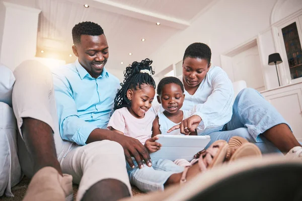 Relax, streaming and tablet with black family in living room for happy, games and elearning app. Digital, technology and internet with parents and children at home for movies, education and network.
