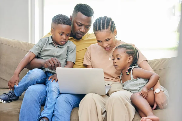 Black family, laptop or education with parents and children bonding on a sofa in the home living room together. Learning, trust or love with a mom, dad and kids streaming an online school video.