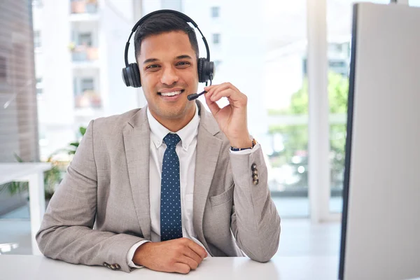Happy man, portrait and call center with headphones in customer service, support or telemarketing at office. Male person, consultant or agent smile for online advice, help or contact us at workplace.