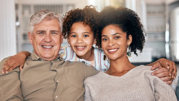 Happy, interracial and portrait of family with hug, care and love for grandfather or mother on sofa. Smile, house and a girl child with a senior man and a mom in the lounge during a visit or bonding.