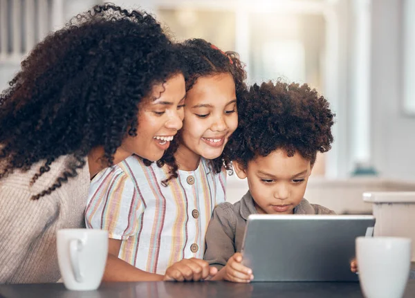 Family, mother and children on tablet for home e learning, online education and watch or streaming cartoon. Happy african kids and mom on digital technology for teaching support and school website.