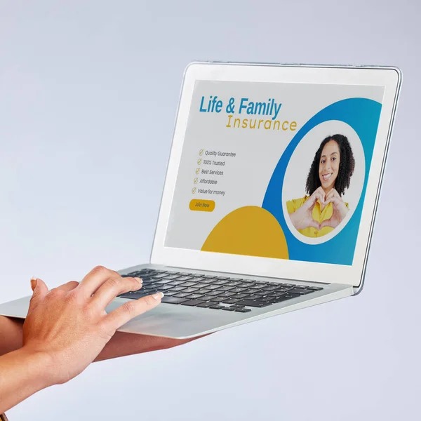 Laptop, hands and insurance website with a customer in studio on gray background for life cover sign up. Computer, security or internet with a female person searching for information about protection.
