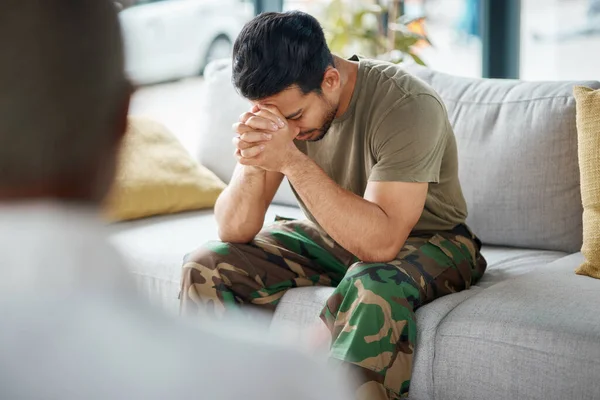 Stress, trauma and male soldier in therapy for mental health, depression or grief after a military war. Frustrated, ptsd and sad man army warrior talking to a psychologist about emotions in a office
