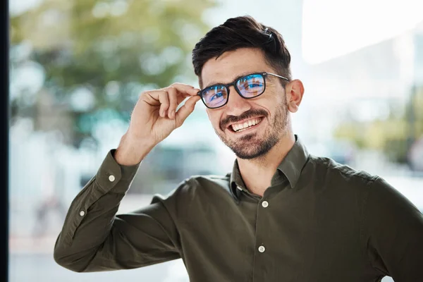 Portrait, face of man and happy with glasses for vision, eyesight and prescription lens. Young male person smile with new frame for designer eyewear, optical fashion and assessment in eye care clinic.
