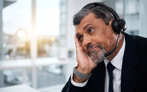 Stress, call center and tired face of man in telemarketing agency with fail, business error and 404 glitch. Bored, mature and confused salesman with challenge, client account problem and CRM crisis.
