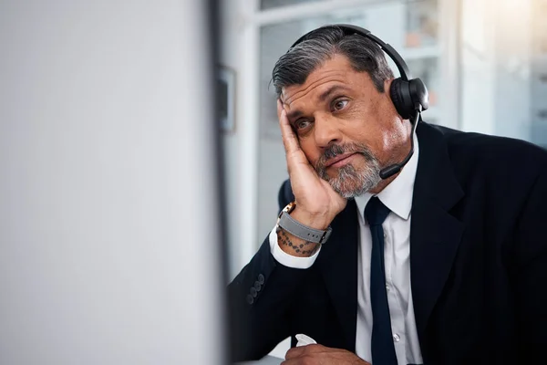 Stress, call center agent and man at computer in telemarketing agency with fail, telecom error and 404 glitch. Bored, mature and confused salesman with challenge, client account problem or CRM crisis.