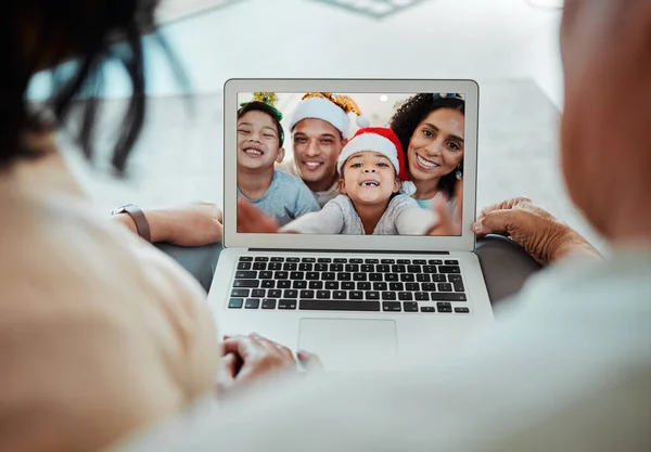 Christmas, family and video call on laptop in portrait, happy and communication. Xmas, computer and kids with parents in online chat for celebration of holiday in virtual webinar with face of couple.