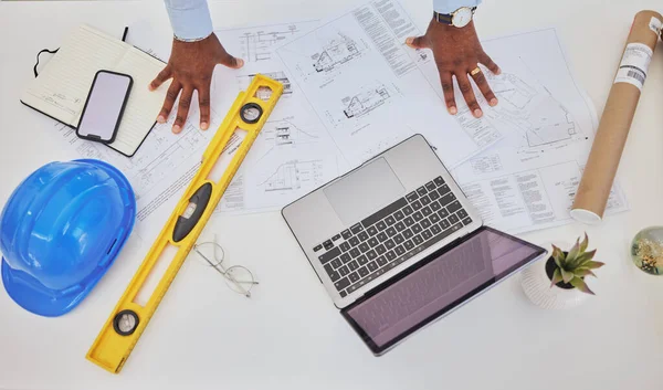 Engineering, laptop or top view of hands in office for architecture, research or building design. Technology, man or designer working online on project management, blueprint or construction planning.